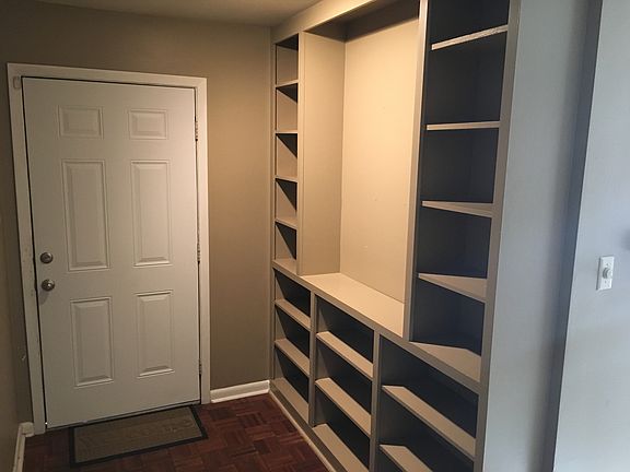 Entrance Hall with built in bookshelves