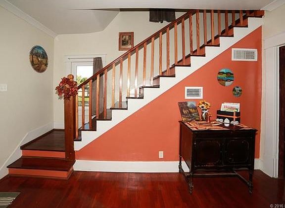 Stair Case leading up to bedrooms and a full bath.