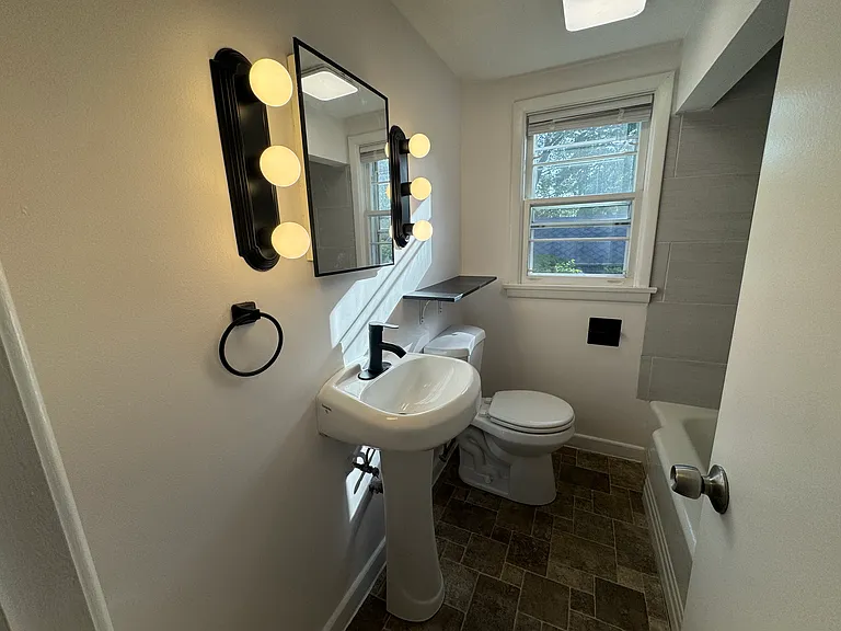 New fixtures in brightly lit bathroom
