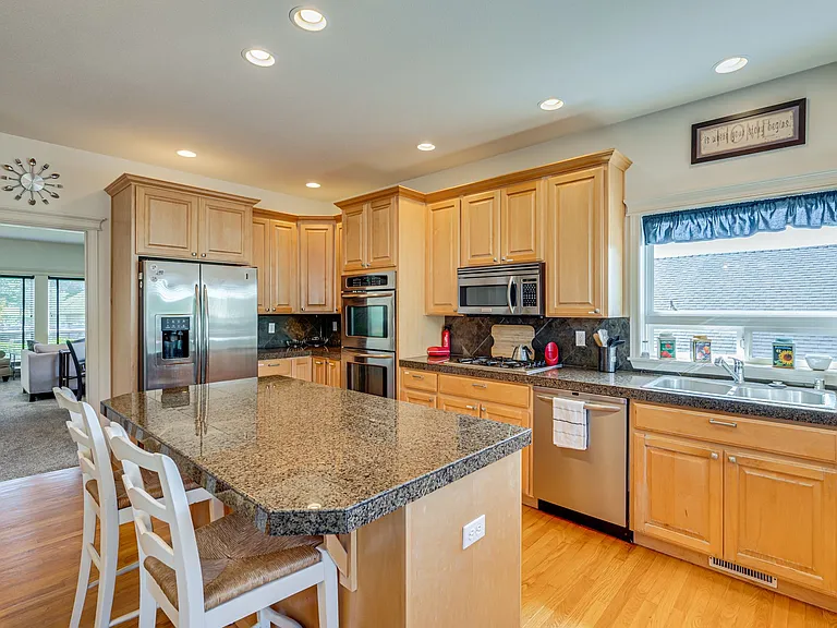 Gas stove, double oven, microwave, island/bar, LOTS of cabinet and counter space