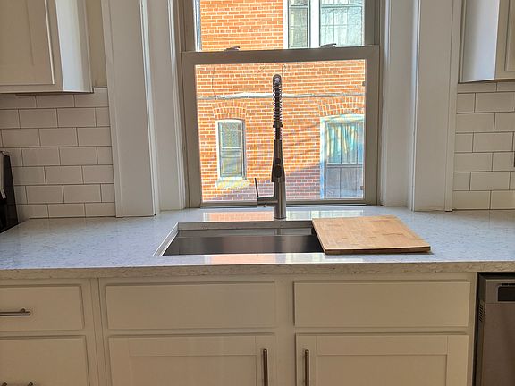 Deep sink with custom cutting board