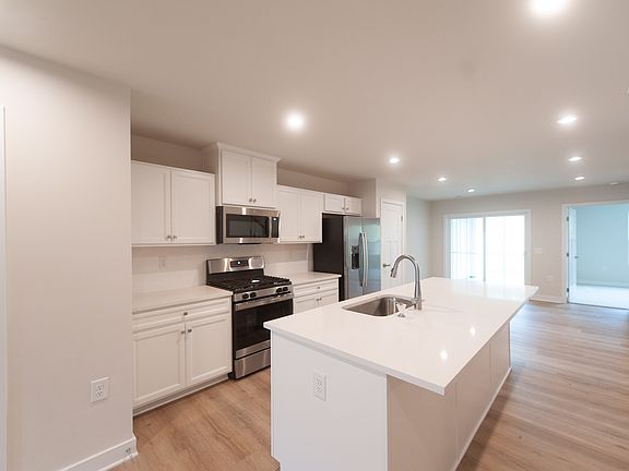 Beautiful quartz countertops, stainless steel appliances including gas range.
Half bath is on the main level.