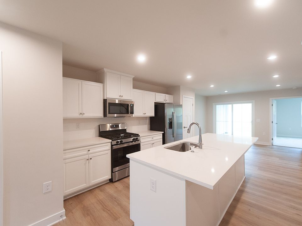 Beautiful quartz countertops, stainless steel appliances including gas range.
Half bath is on the main level.