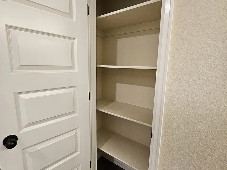 Master bathroom linen closet.