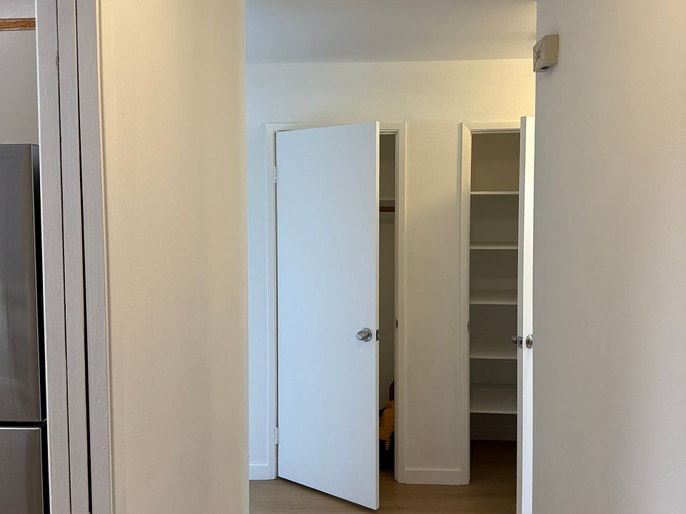 unit entrance, left to kitchen, straight left to sitting room and right to bedrooms; coat and liner closets in hallway