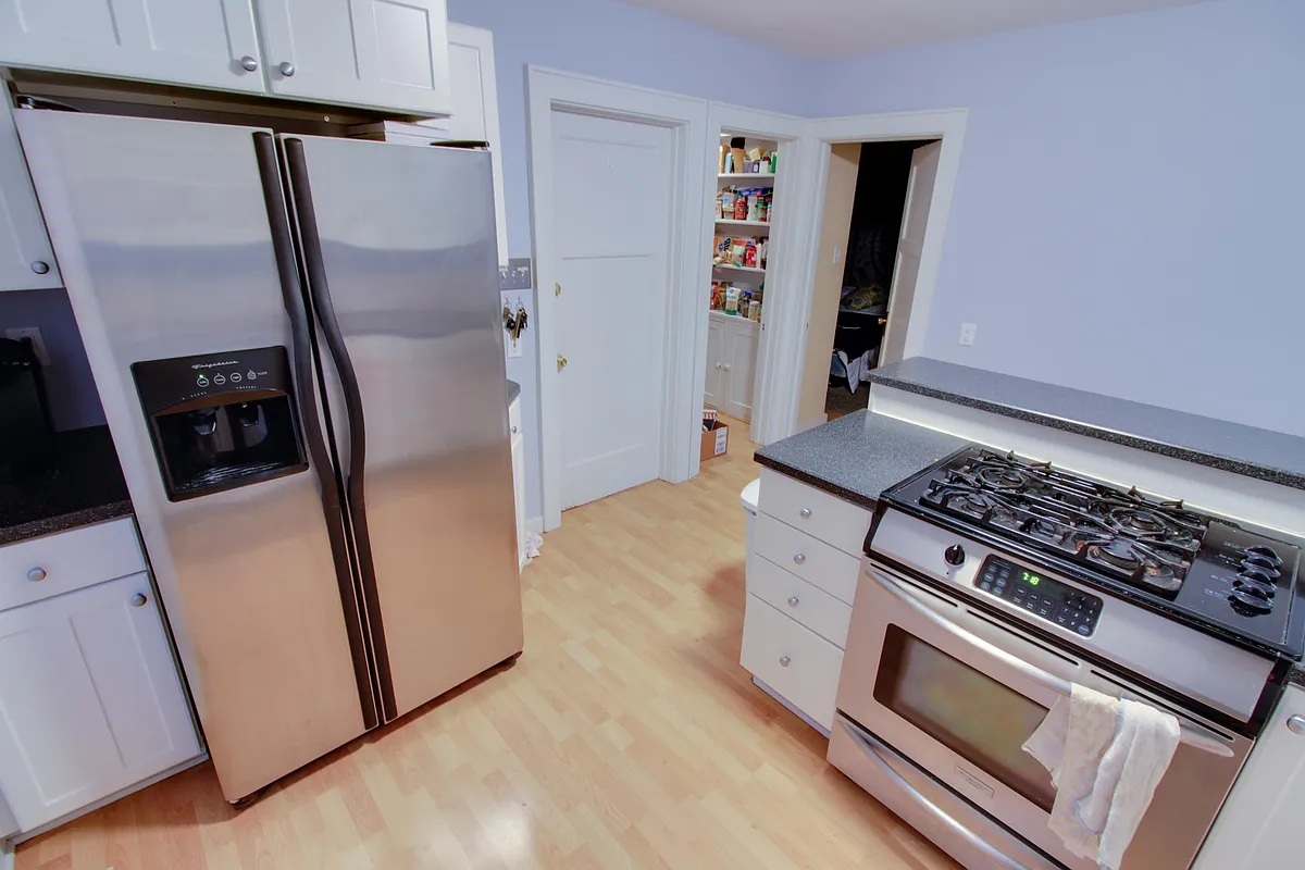 Kitchen with stainless steel appliances. - 1621 N Astor St #LOWER