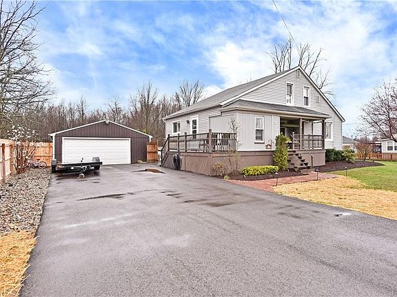 Recently paved driveway, 2.5 car garage - will satisfy your must have criteria. And an extra gym/storage space at the back of th