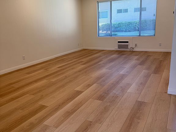 LIVING ROOM...NEW FLOORS AND CANNED LIGHTS PROVIDING GREAT LIGHTING. PLUS NICE LARGE WINDOW FOR NATUAL LIGHTING