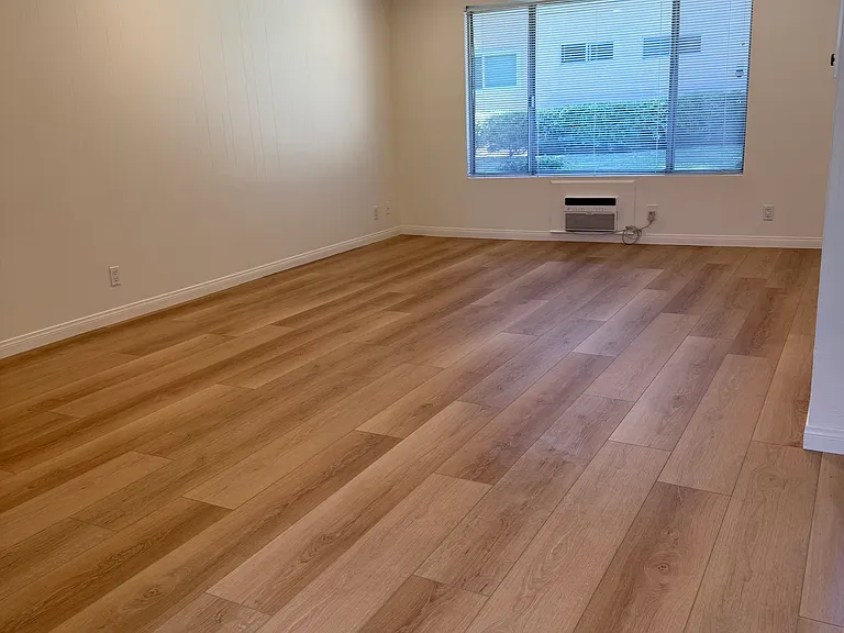LIVING ROOM...NEW FLOORS AND CANNED LIGHTS PROVIDING GREAT LIGHTING. PLUS NICE LARGE WINDOW FOR NATUAL LIGHTING