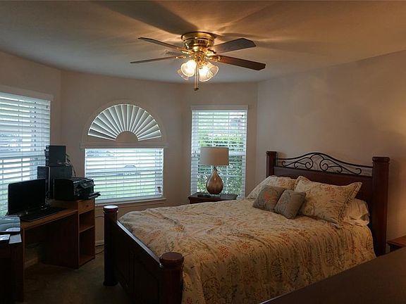 Bay window adds ambiance to this bedroom.