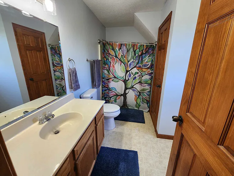 Second floor bathroom, tub and shower combo