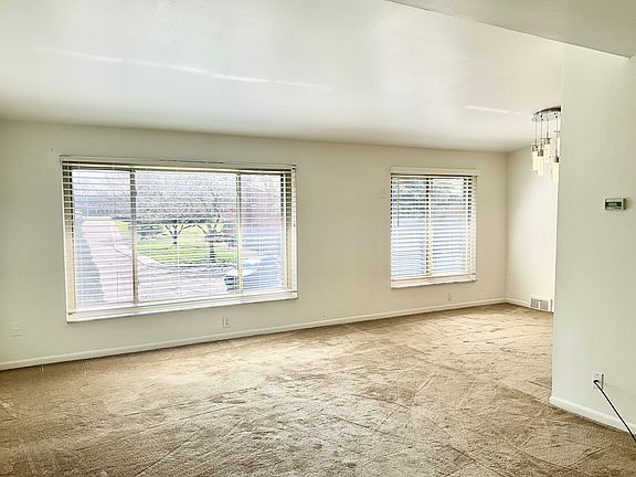 Tons of light flows into this spacious Living Room/Dining Room combination.
