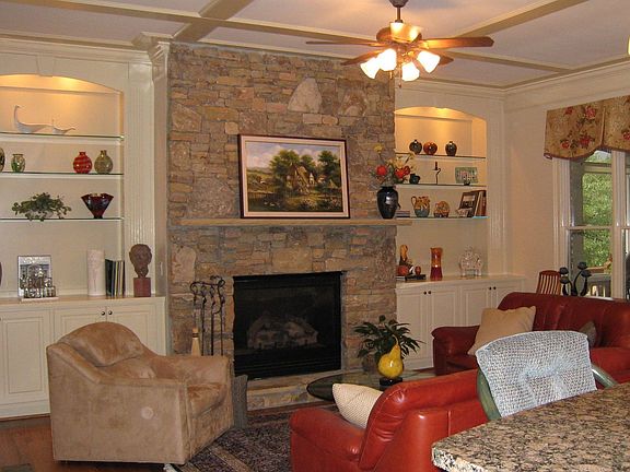 Family room w/built-ins & stacked stone fireplace