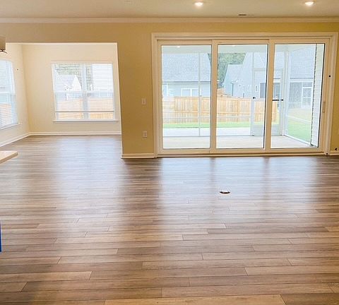 Spacious sunroom, dinning room and living room combined, open floor plan, huge sliding door to go to screen porch