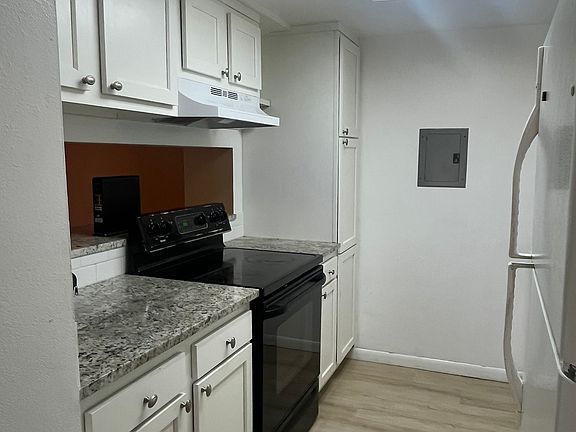 Kitchen with newer countertops and flooring