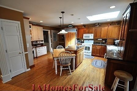 Kitchen showing large skylight and 2-level island.