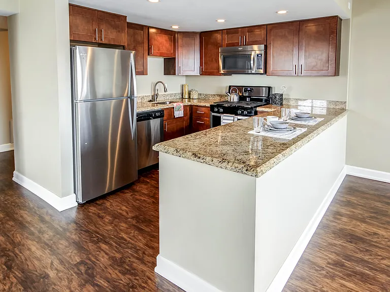 Upgraded Kitchens with granite, stainless steel and new cabinets in select units