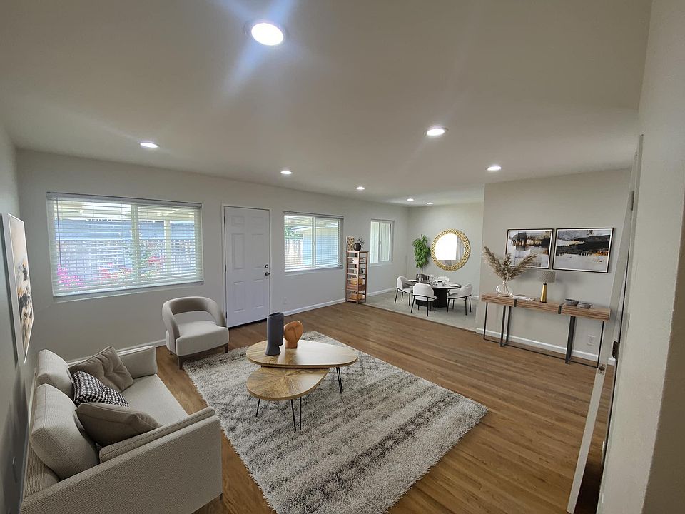 This was a virtual staging picture in order to show a larger view of the living room and dining room space.