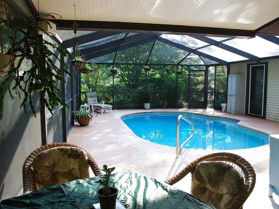 screen enclosed solar heated in ground pool
