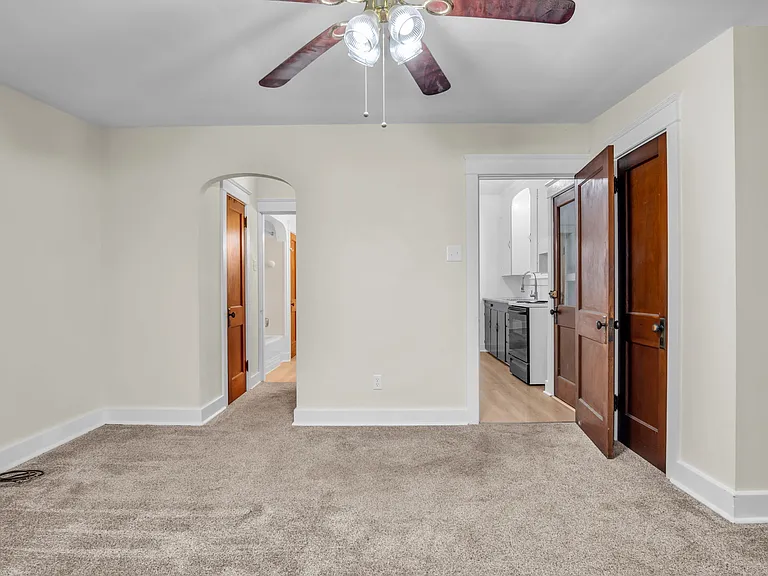 Bedroom 1 15.5'x14.5' in the rear facing Kitchen and Bathroom