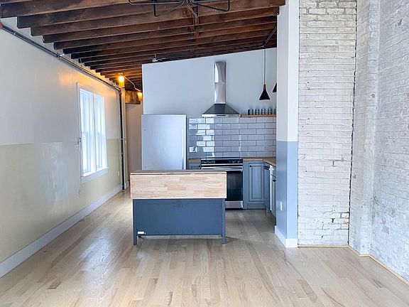 Kitchen from living room, exposed beams