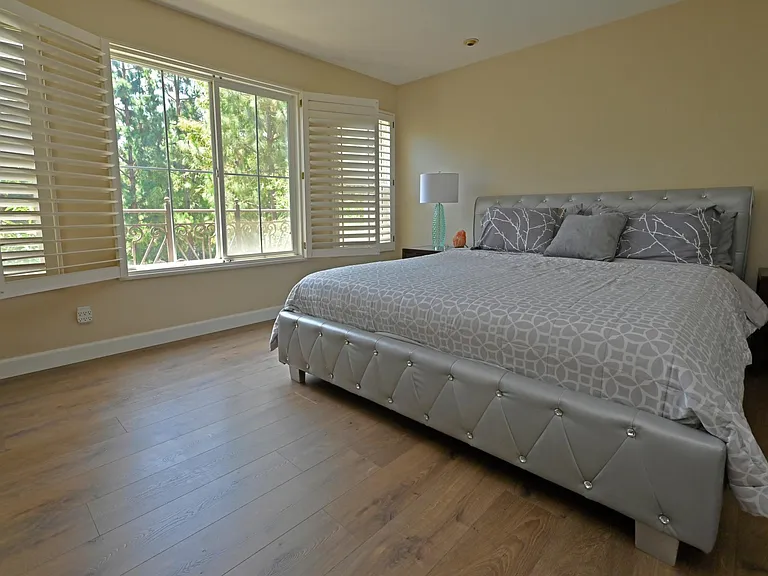 Master bedroom with park view with no one in the front to overlook the biking trails