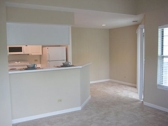 Living Rm Looking Into Kitchen & Dining