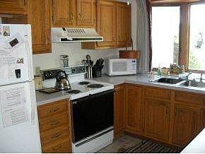 kitchen open to dining/living