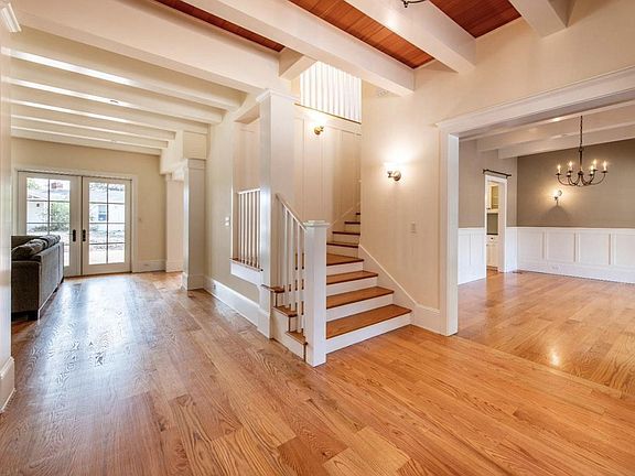 View of foyer, stairs and formal dining room