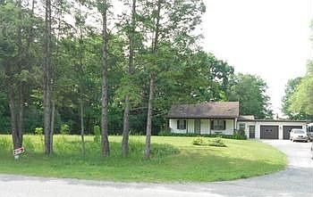 Much bigger than it looks with two rooms in the basement that have egress windows.  Garage has it's own wood burner and is insulated. 