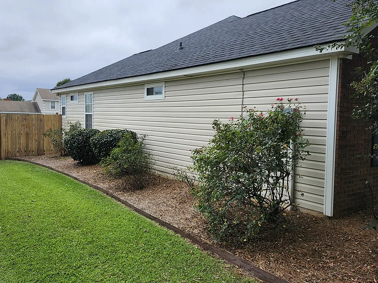 Close-up view of the left side of the property. See rear back view to enter the backyard through the fence.