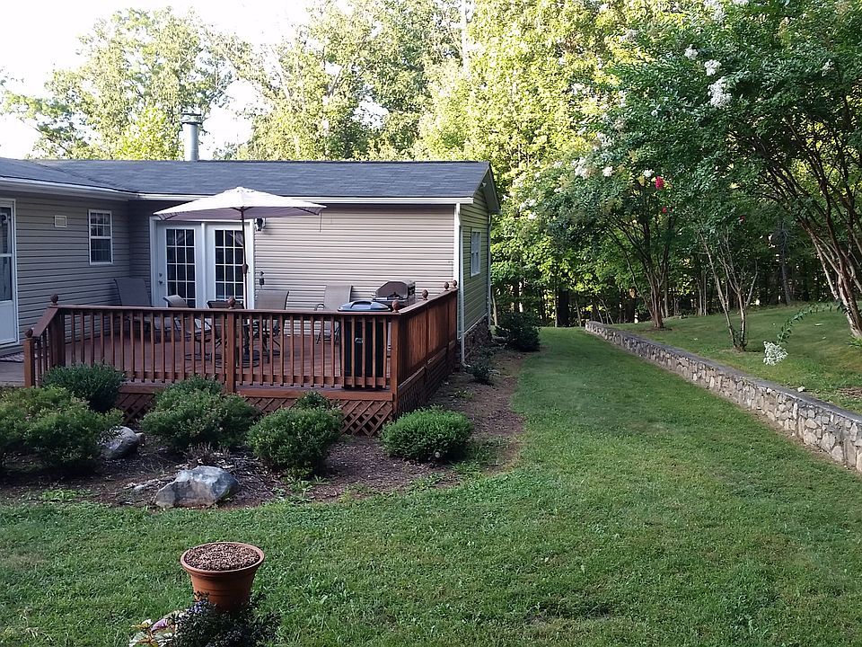 Back of house with deck