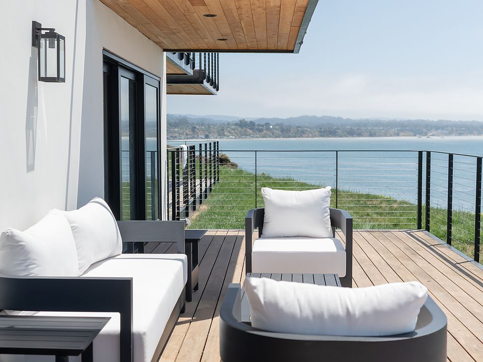 Expansive private oceanfront deck _ the largest in the building _ perfect for entertaining or relaxing with panoramic views of the Monterey Bay.
