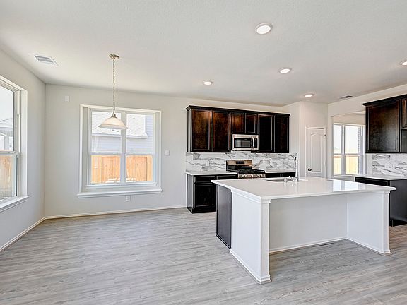 The Princeton- Family Room into Kitchen. Home under construction. Sample photo used for illustrativ