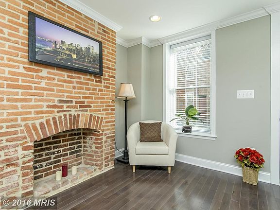 Living Room features decorative fireplace