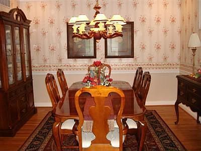 Dining Room with treyed ceiling