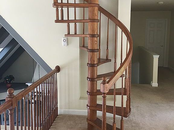 Wooden spiral stairway to lo
