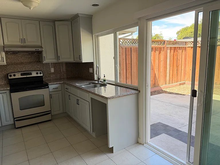 Kitchen view to outdoor patio/yard area
