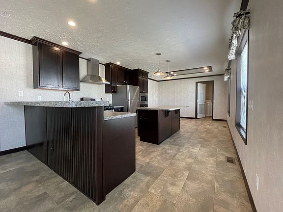 2nd image of 7204 E Grand River Ave #387