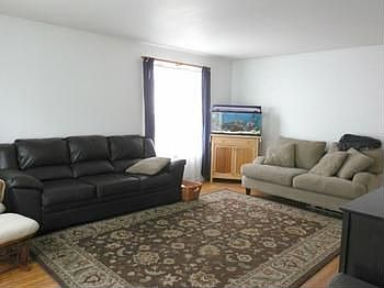 Spacious living room with shining hardwood floor