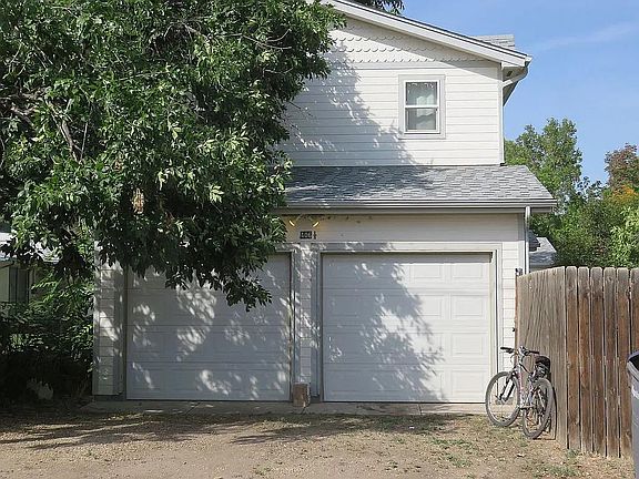 Double car garage faces the alley. The left side is for this house, with a door into the Living Room. The right side is for use by the main house.