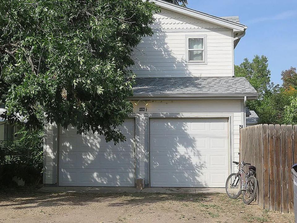 Double car garage faces the alley. The left side is for this house, with a door into the Living Room. The right side is for use by the main house.