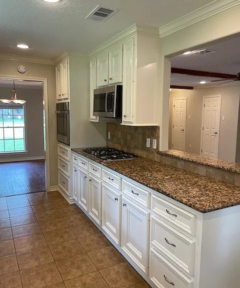 Kitchen with all new stainless appliances.