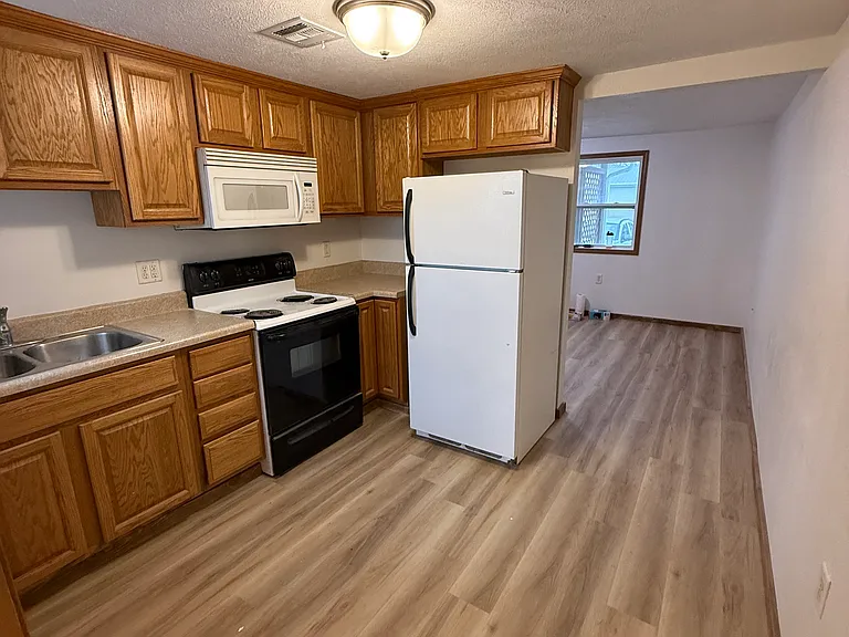 A new glass top stove / oven has been upgraded in this spacious dine-in kitchen.