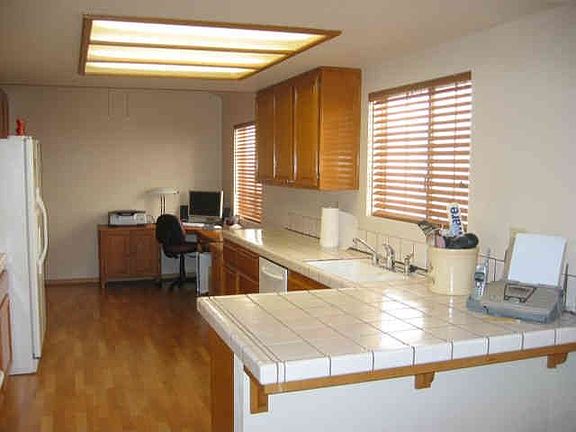 At the back of the kitchen is a breakfast nook or use as a home office