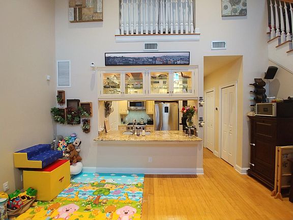 View of the kitchen and dining area (play area) from the living room.