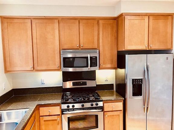 Kitchen has a lot of cabinet spaces, gas range and oven, micro wave oven, double door fridge and a pantry.