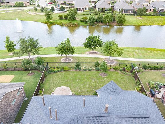 There are 4 Bedrooms, 3.5 baths, and with a three car air conditioned garage in this Perry Homes built charmer.