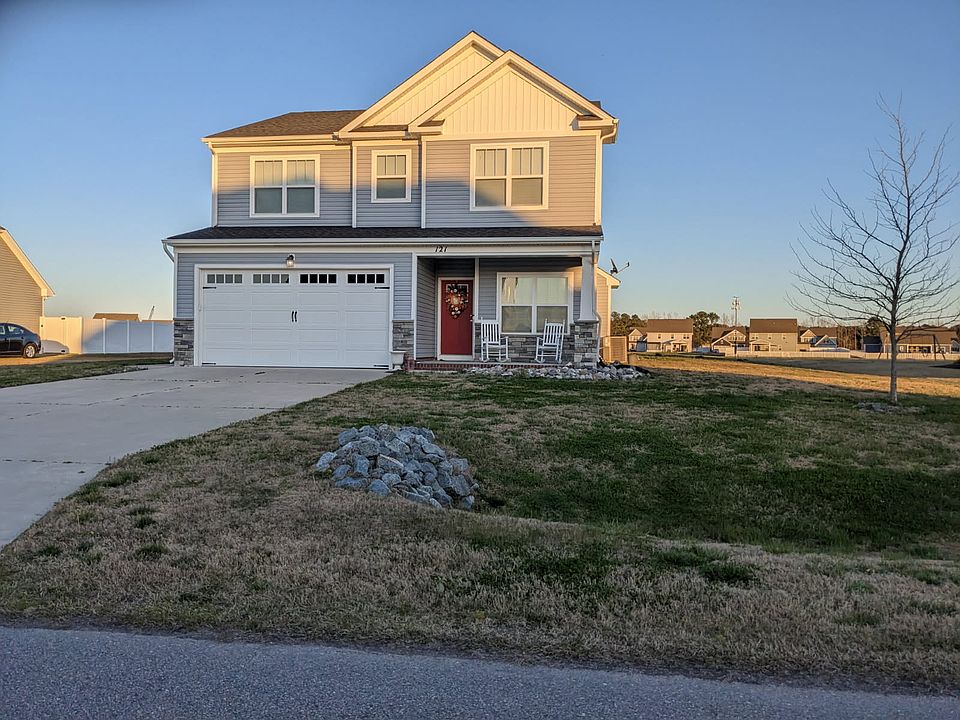 Front view of the home as the sun goes down.