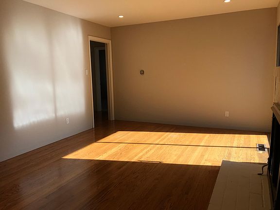 Living room with wood-burning fireplace